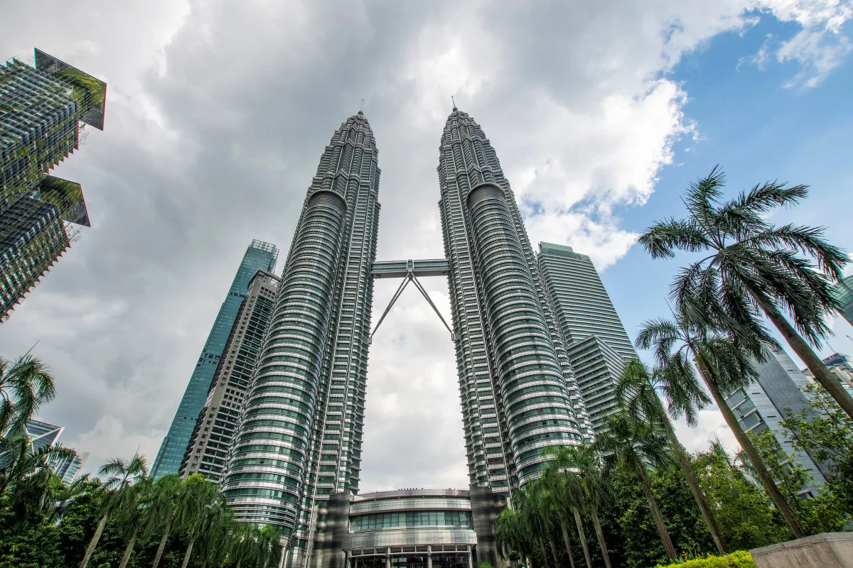 The Petronas Twin Towers and their skybridge seen from KLCC Park