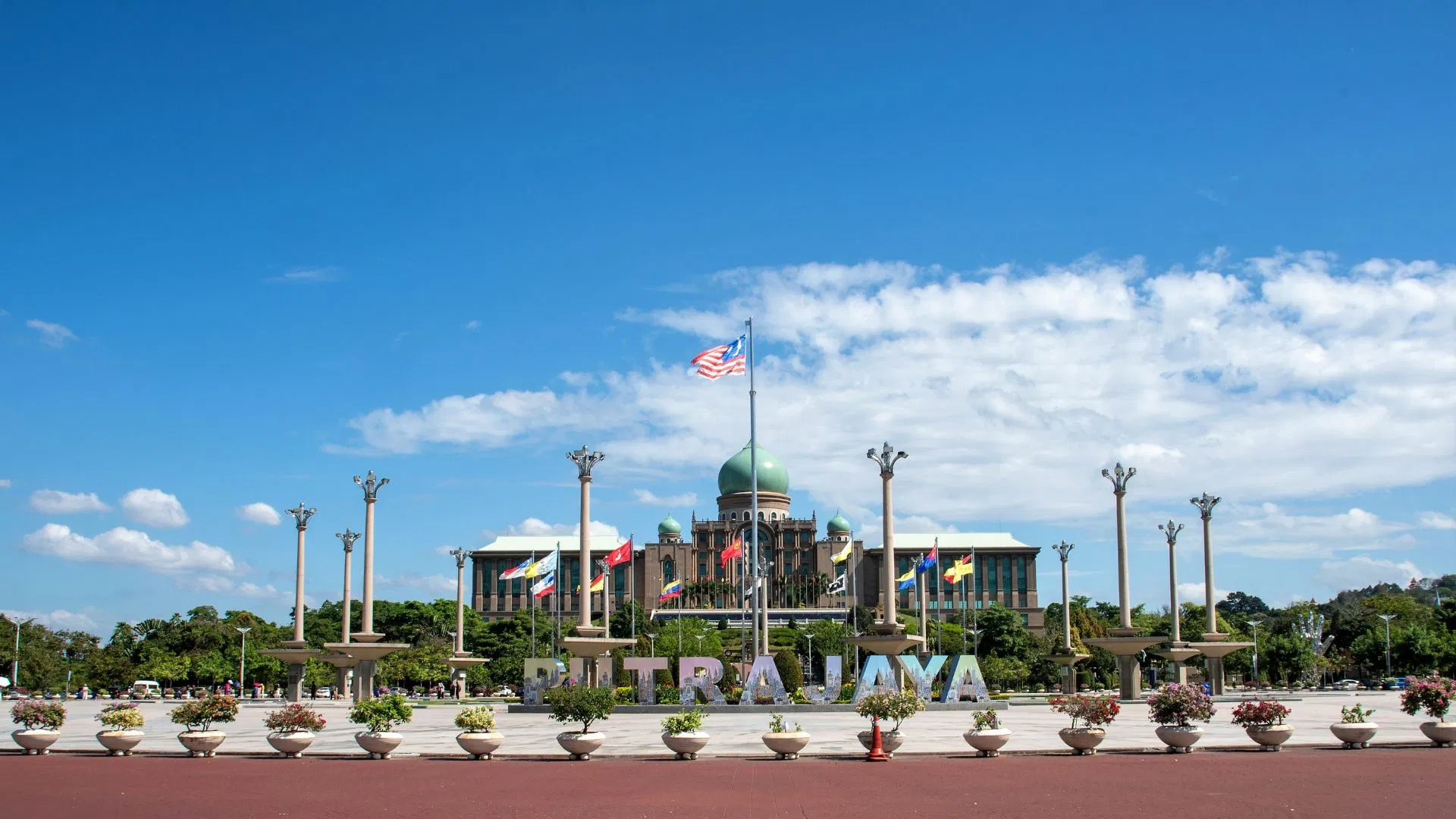Putra Square with the PUTRAJAYA lettering, the flagpoles and Perdana Putra behind