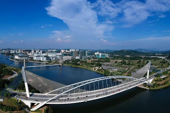 The Seri Saujana bridge from the air, its arch and cable stays spanning Putrajaya Lake