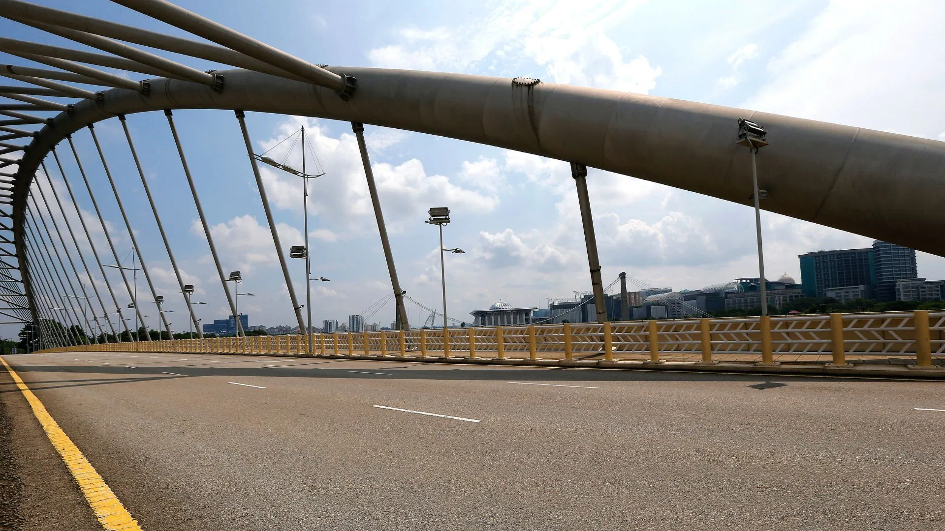 The arch of the Seri Saujana bridge springing over its carriageway in Putrajaya